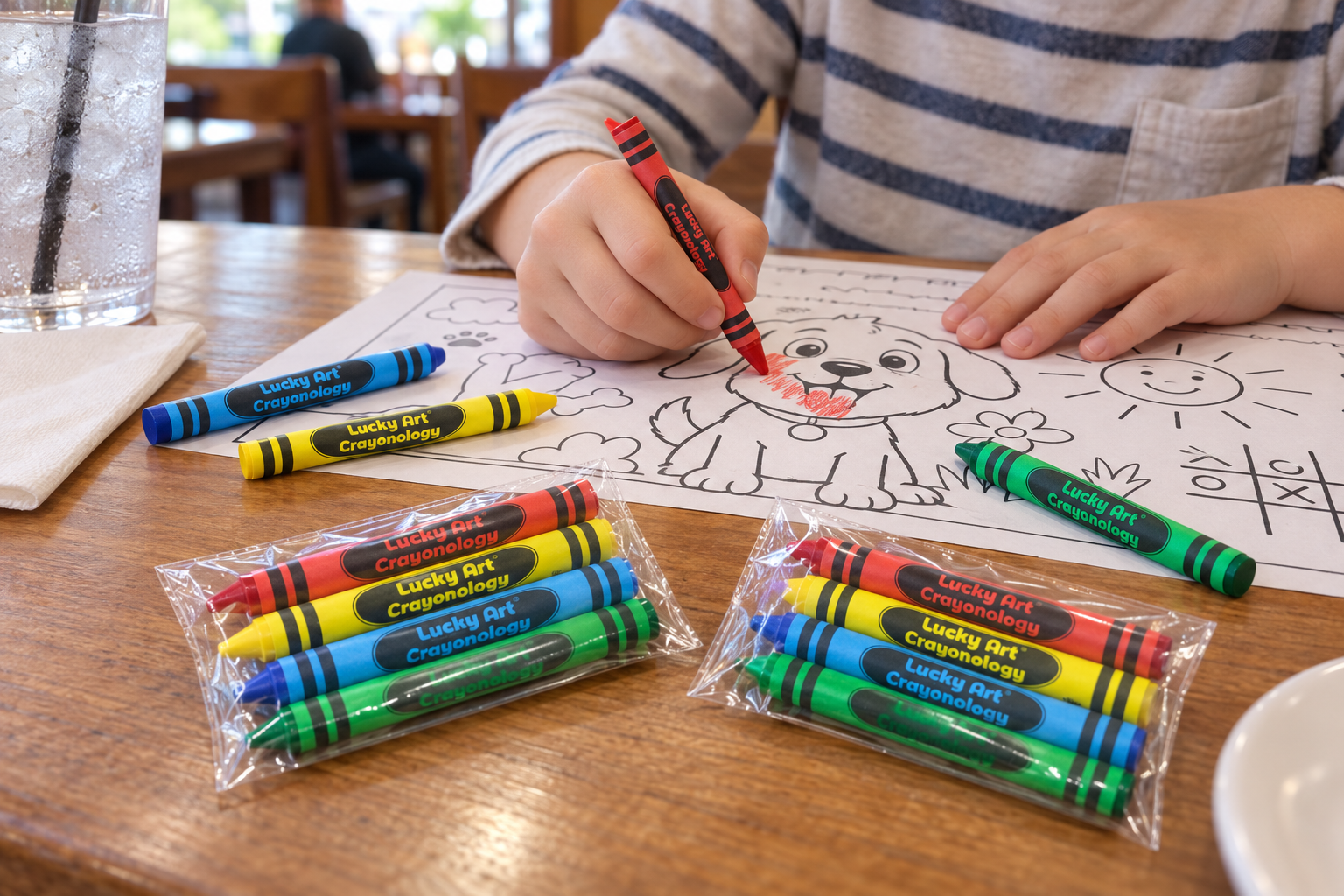 Four-color crayon packs at a restaurant activity table